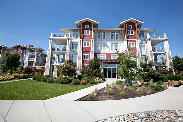 A building with many windows and doors on the outside.