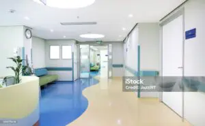 A hospital room with blue and white floors