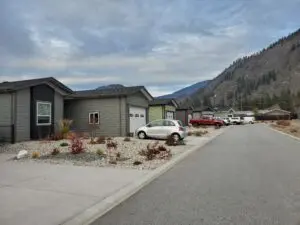 A street with cars parked on the side of it.