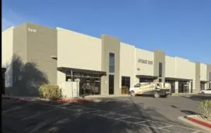 A large building with a truck parked in front of it.