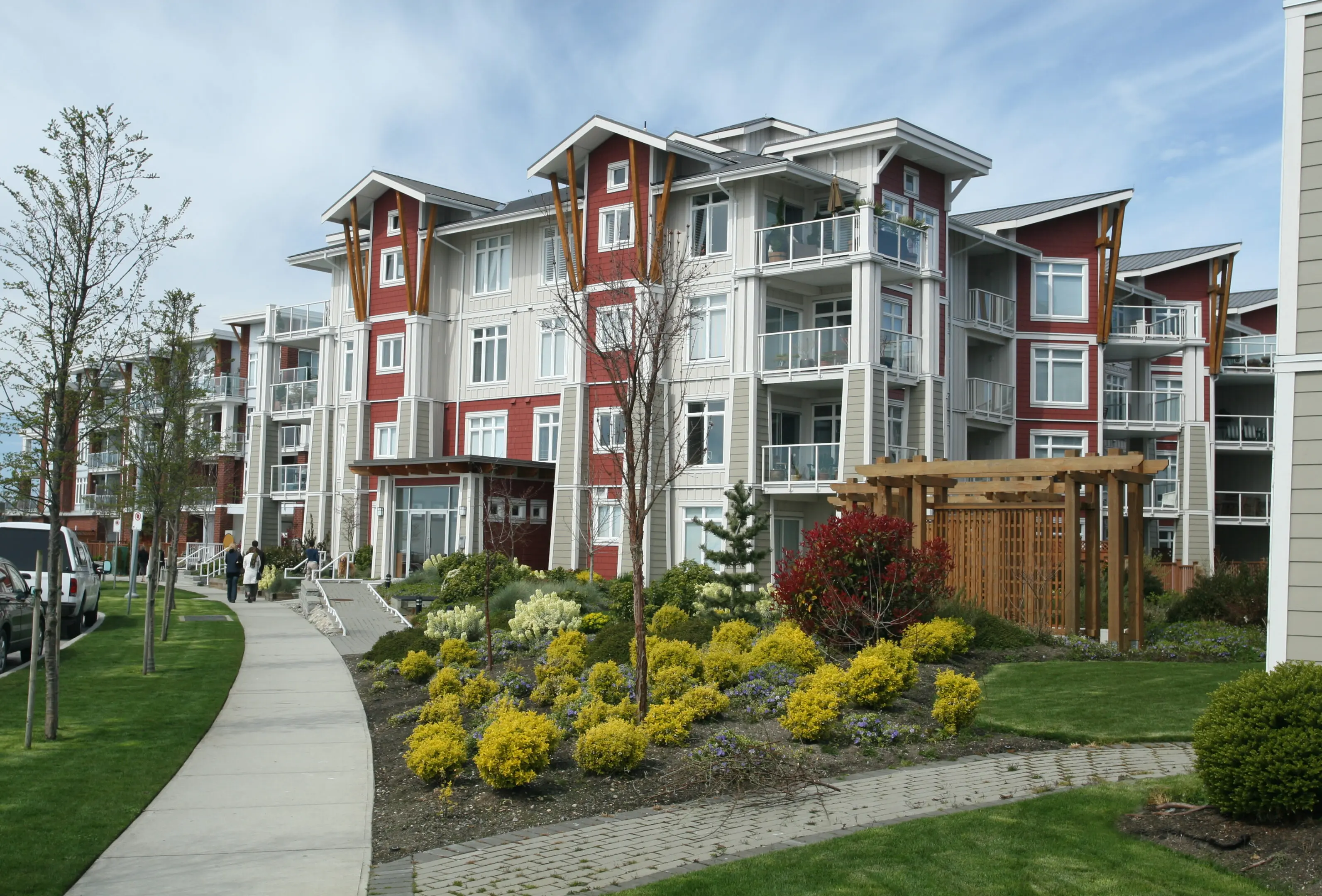 Newly constructed condominium building in suburban setting.